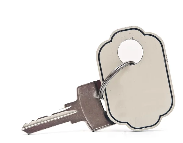 Zilveren sleutel met lege tag. ruimte voor uw tekst — Stockfoto