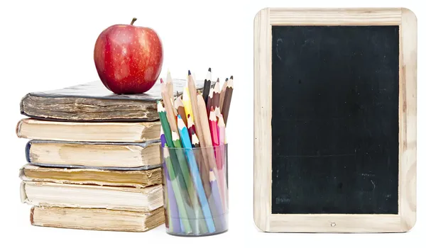 Small chalkboard with an apple, a pencils and books — Stock Photo, Image