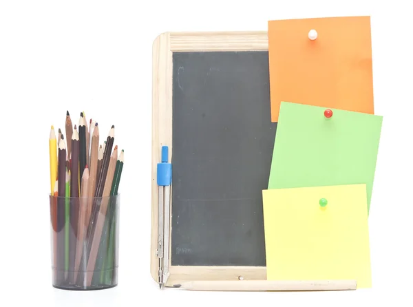 Small wooden blank blackboard with school stationery on white ba — Stock Photo, Image
