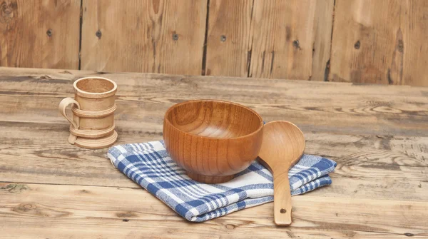 Wooden kitchen utensils on wooden table — Stock Photo, Image