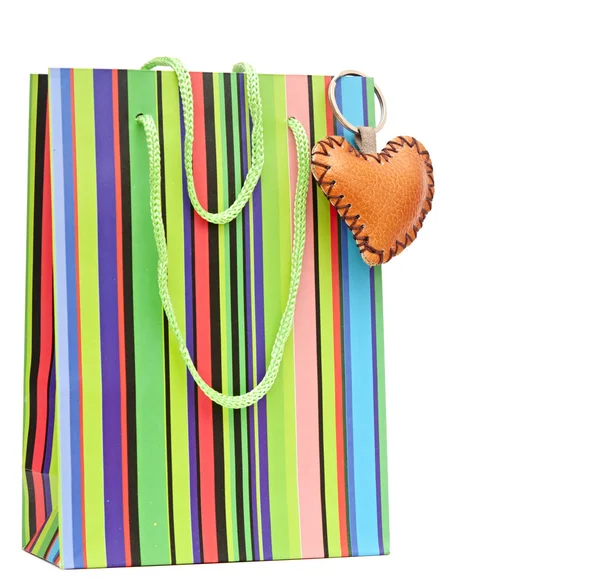 Colorful paper shopping bag with brown heart — Stock Photo, Image