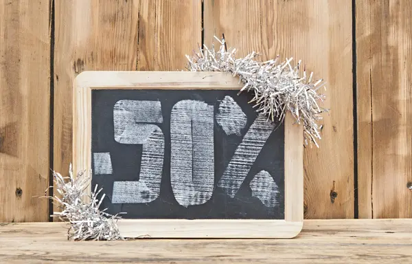 Fifty percent discount written on blackboard — Stock Photo, Image