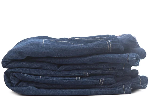 Stack of blue jeans on white background — Stock Photo, Image