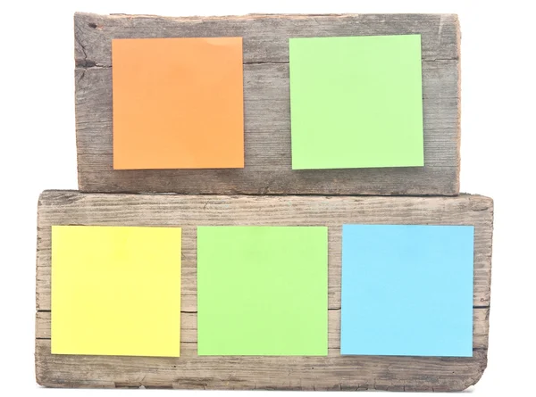 Colorful reminder notes attached on a old wooden signboard — Stock Photo, Image