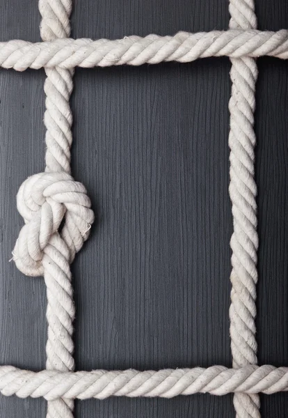 Frame made of rope on a wooden background — Stock Photo, Image