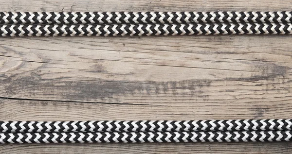 Frame of rope on a old wooden background — Stock Photo, Image