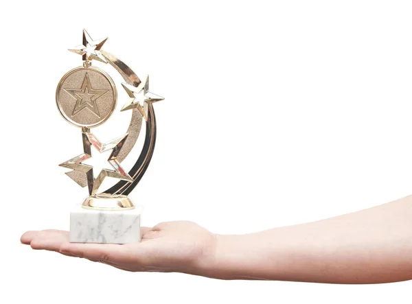 Award winner holds a golden cup star — Stock Photo, Image