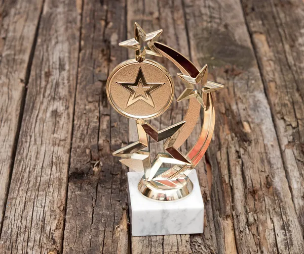 Star award with space for text on old wooden table — Stock Photo, Image