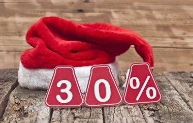 eski ahşap zemin üzerinde santa şapka ile yüzde 30'u