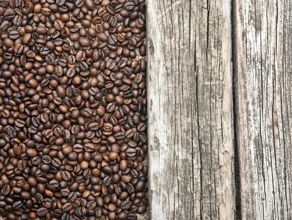 Coffee beans border old wood background — Stock Photo, Image