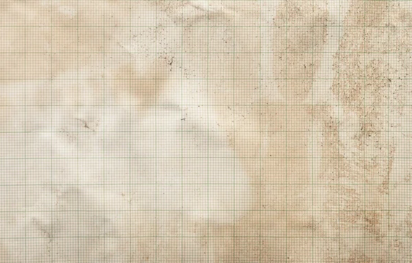 Sheet of graph paper stained by coffee background — Stock Photo, Image