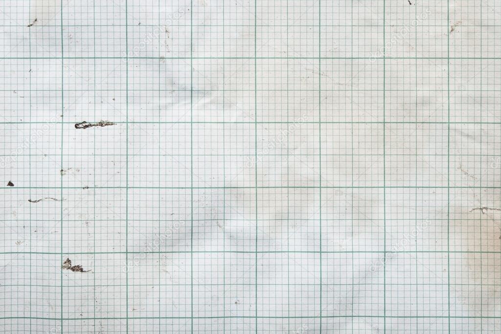 sheet of graph paper stained by coffee background