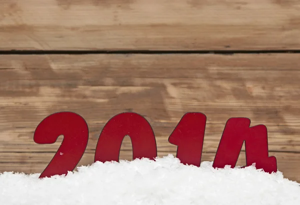 Anno 2014 in neve fresca contro muro di legno — Foto Stock