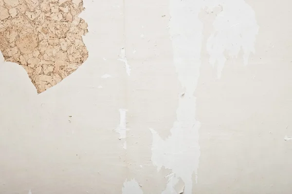 Hand removing wallpaper from wall — Stock Photo, Image