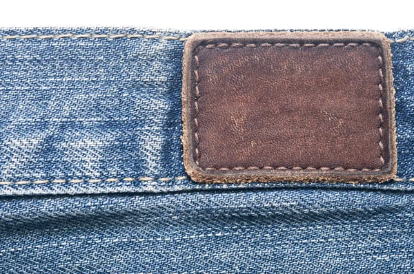 Lederen jeans label naaide op jeans. — Stockfoto