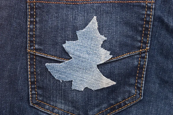 Vánoční pozadí: džíny textury s tvarem vánoční strom. — Stock fotografie