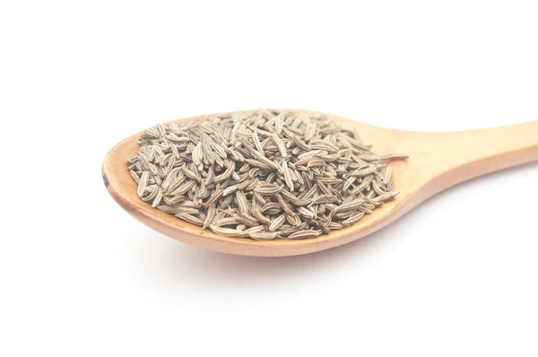 Cumin seeds in wooden spoon — Stock Photo, Image