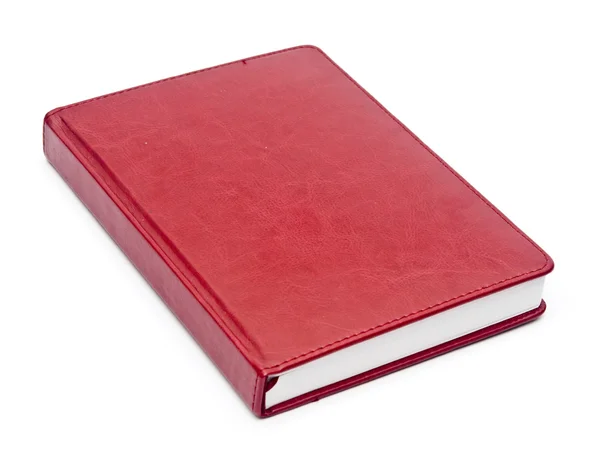 Red leather notebook over white background — Stock Photo, Image