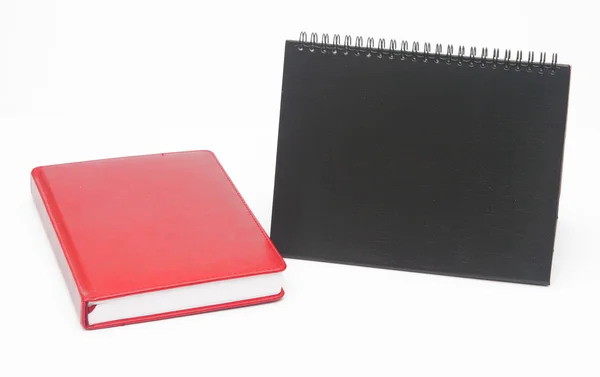 Notebook e calendário em branco no fundo branco . — Fotografia de Stock