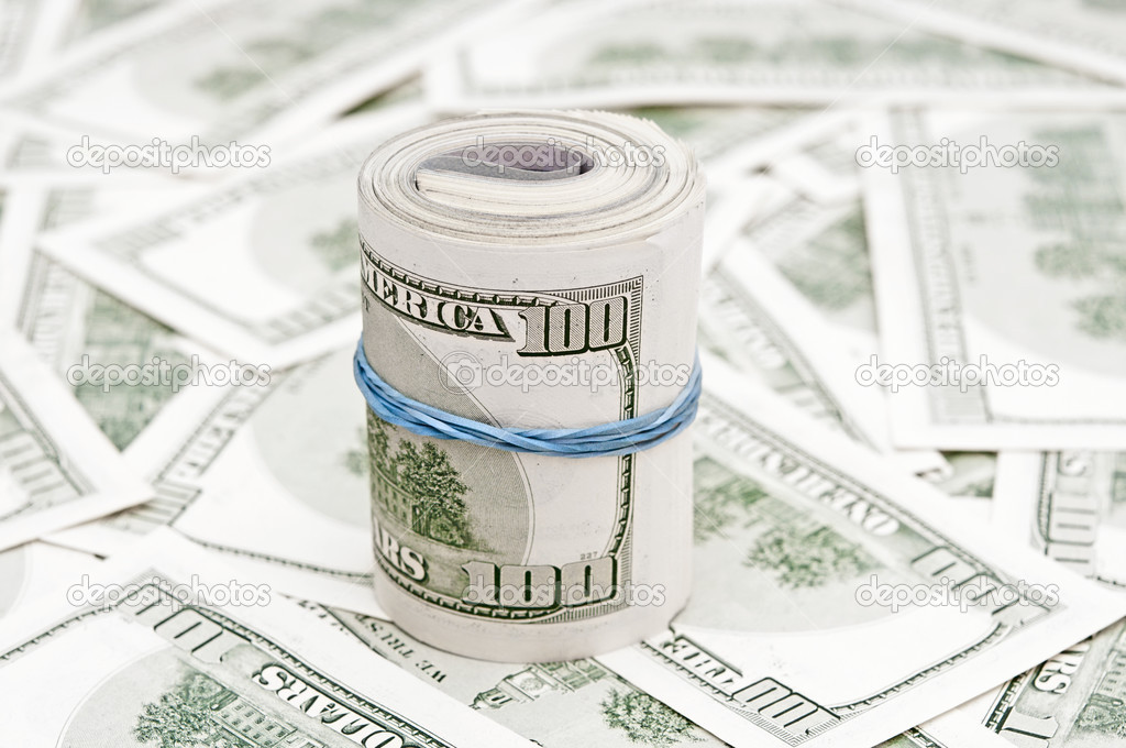 Background with money american hundred dollar bills and roll of 