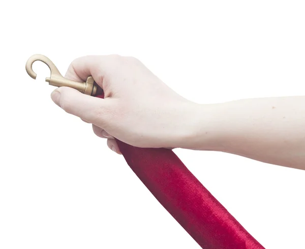 Lidská ruka otevření červeným sametem lano — Stock fotografie