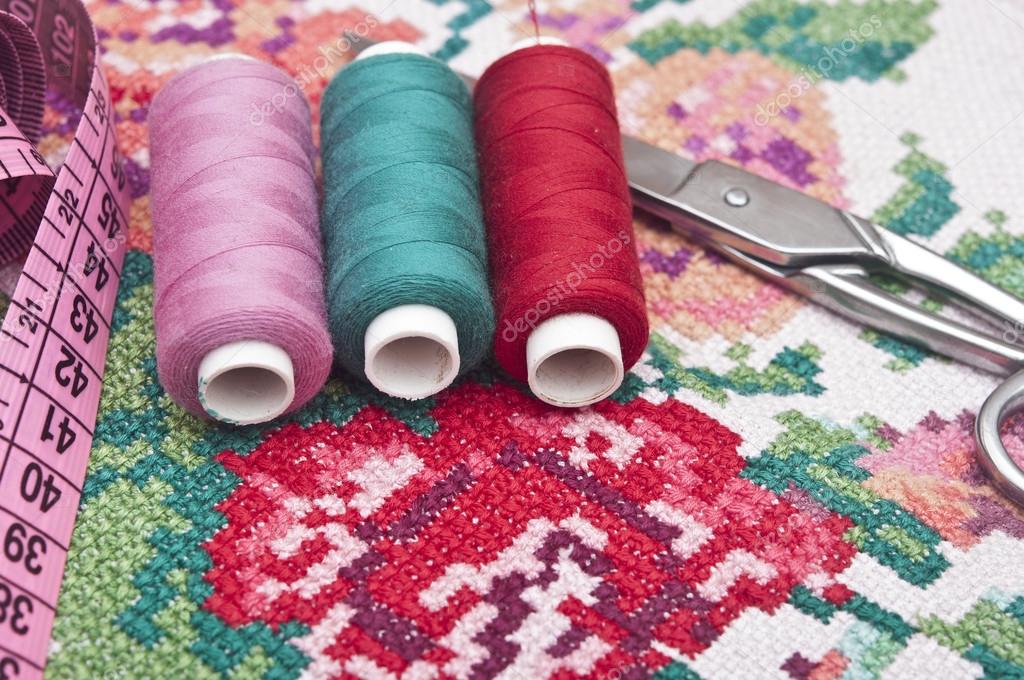 Cross-stitch set: colorful threads and canvas 