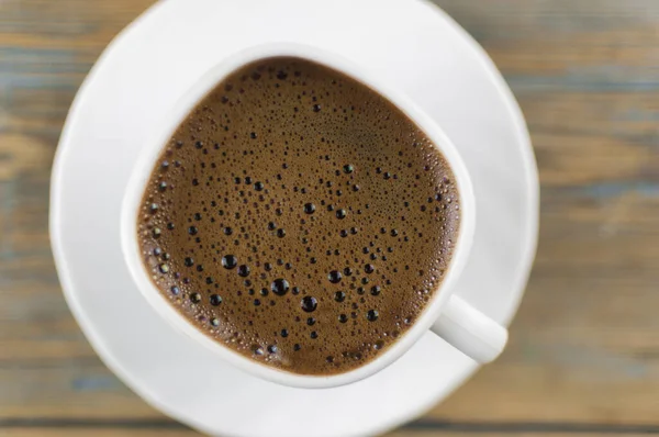 Vista Dall Alto Una Tazza Caffè Uno Sfondo Legno Con — Foto Stock