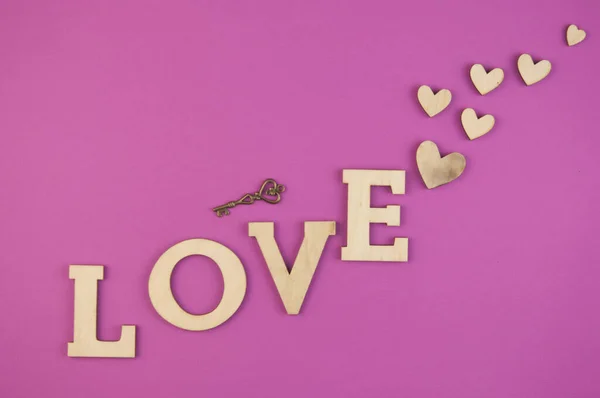 Liefdeswoord Hartjes Roze Pastelachtergrond Bovenaanzicht Van Valentijnsdag Kopieerruimte — Stockfoto