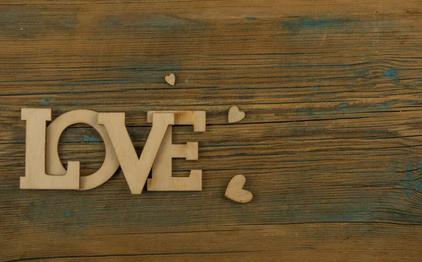 Aşk Kelimesi Dold Woodr Arka Planında Küçük Kalpler Sevgililer Günü — Stok fotoğraf