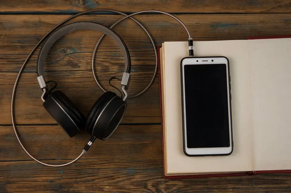 Audiobooks Book Headphones Black Wood Table Top View — Stock Photo, Image