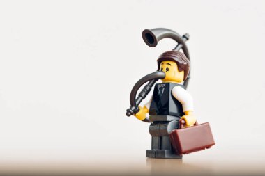 Businessman with giant horn. Announcement concept. Illustrative editorial. December 25, 2021