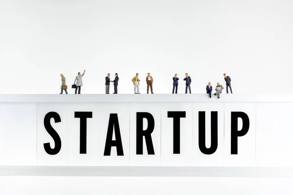 Startup Concept Miniature People Top Lightbox Word Startup — ストック写真