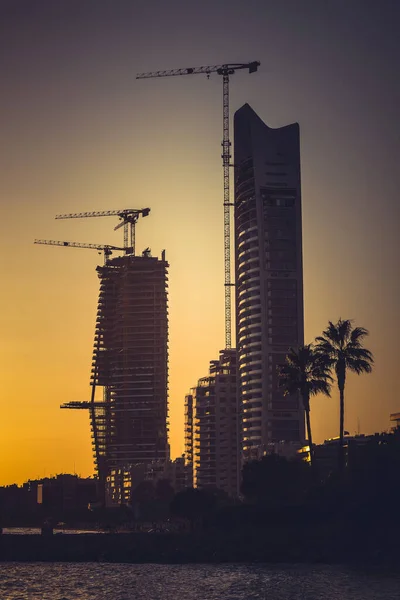 Skyscraper construction site on sunset. Limassol, Cyprus