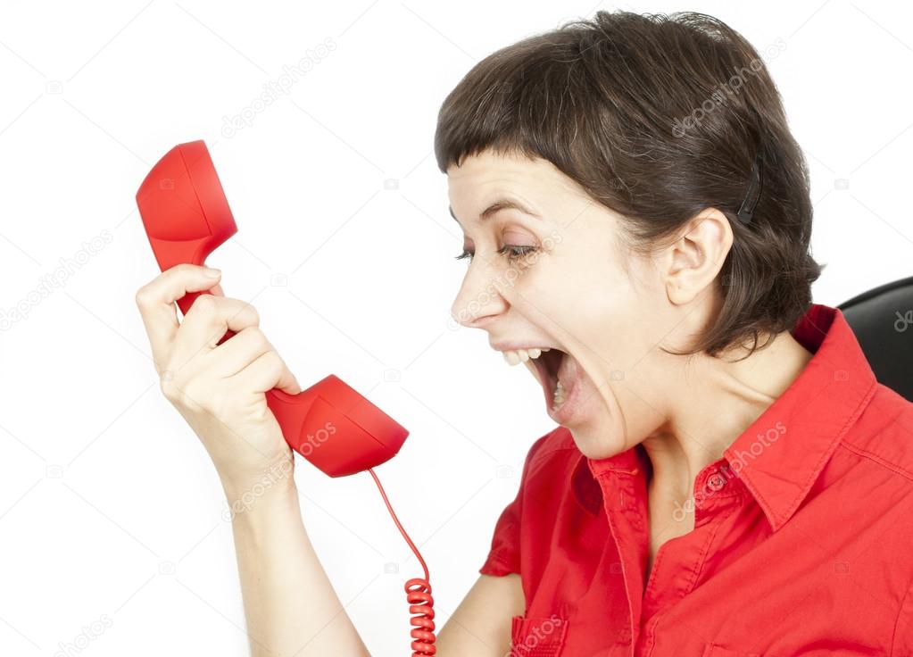 Businesswoman screaming into a phone