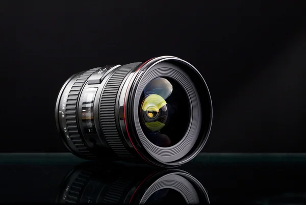 Camera lens on black background — Stock Photo, Image