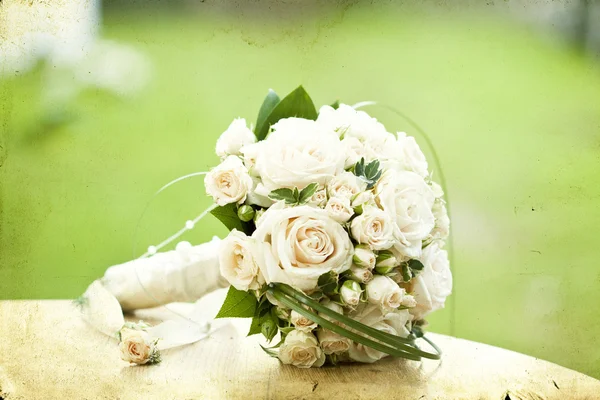 Vintage photo of white wedding bouquet — Stock Photo, Image