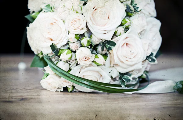Vintage photo of white wedding bouquet — Stock Photo, Image