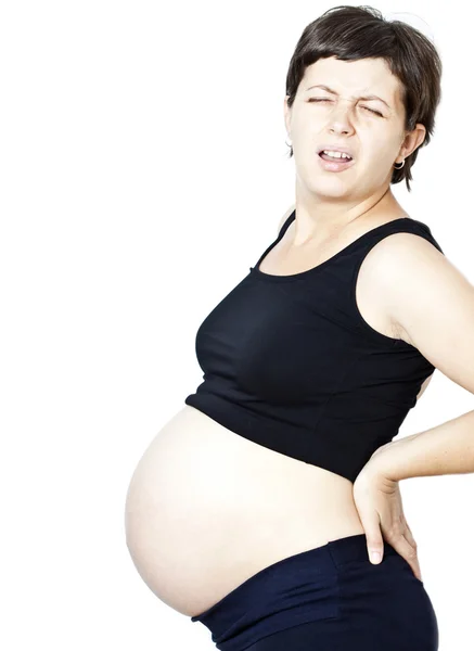 Беременная женщина выглядит обеспокоенной — стоковое фото