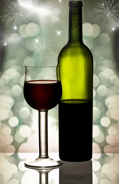 Red wine against holiday lights — Stock Photo, Image