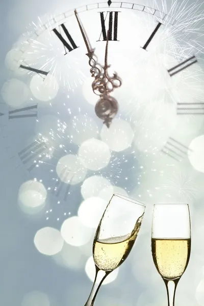 Glasses of champagne against holiday lights — Stock Photo, Image