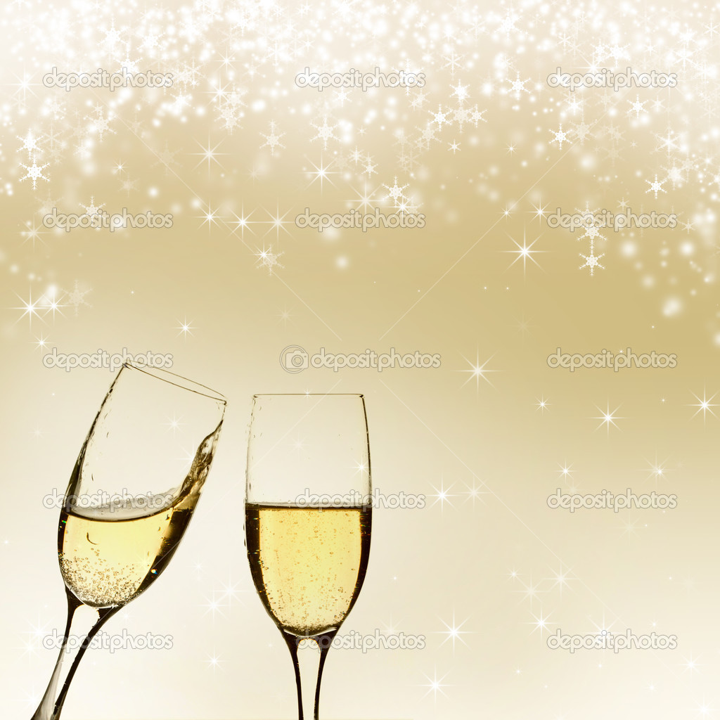 Glasses with champagne against holiday lights