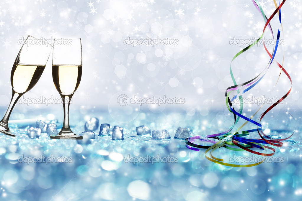 Glasses with champagne against holiday lights