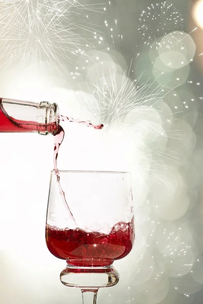 Pouring red wine at midnight — Stock Photo, Image