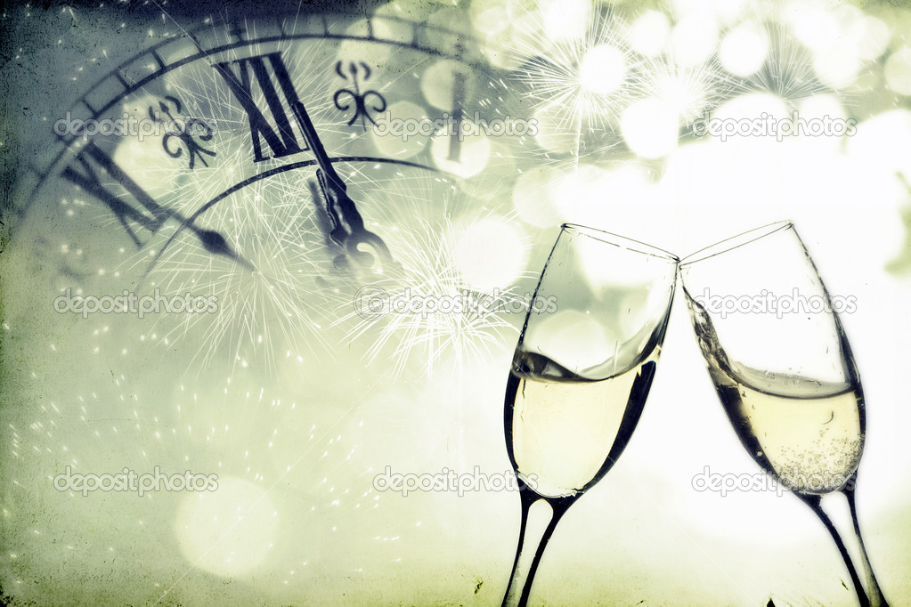Glasses with champagne over holiday background