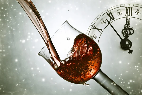 Pouring red wine at midnight — Stock Photo, Image