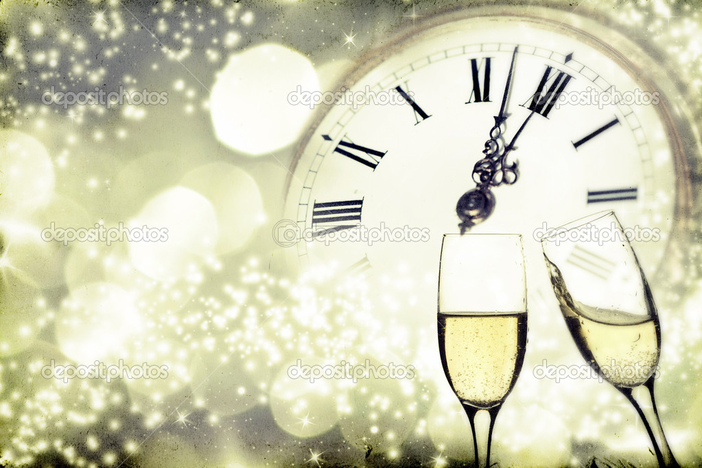 Glasses with champagne over holiday background