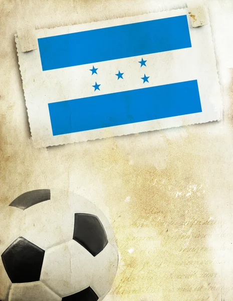 Фото флага Гондураса и футбольного мяча — стоковое фото