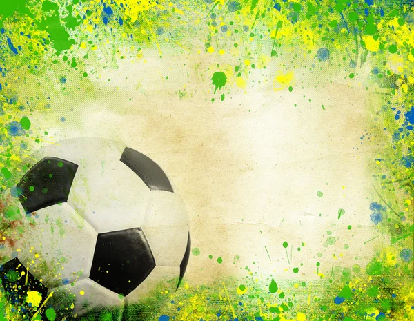 Fotbalový míč a barvy vlajky Brazílie — Stock fotografie