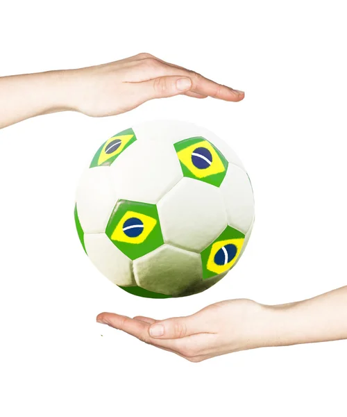 Hands holding soccer ball — Stock Photo, Image