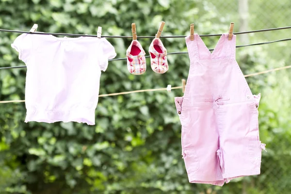 Baby clothes hanging — Stock Photo, Image